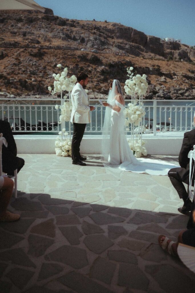 Romantic destination wedding on Rhodes, Greece, photographed in Lindos St Paul Bay