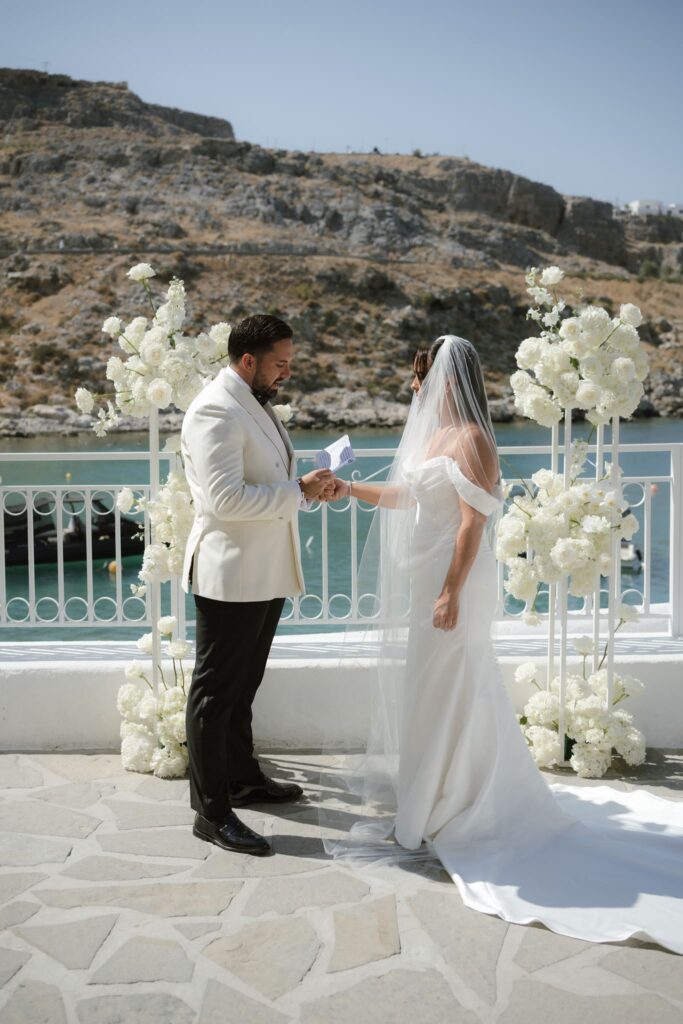 Romantic destination wedding on Rhodes, Greece, photographed in Lindos St Paul Bay