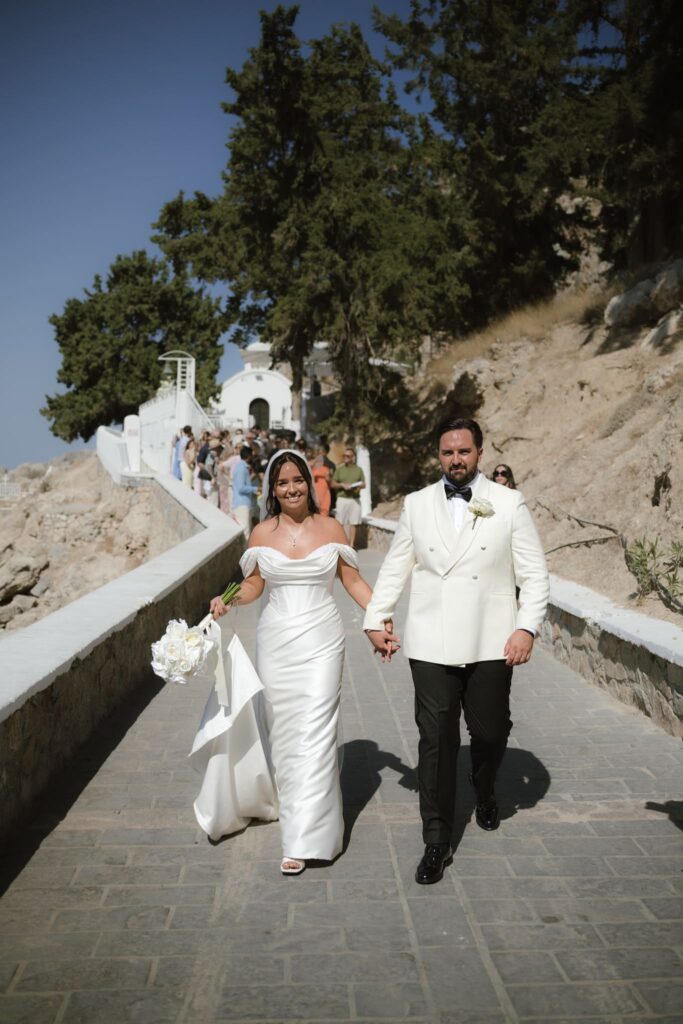 Romantic destination wedding on Rhodes, Greece, photographed in Lindos St Paul Bay