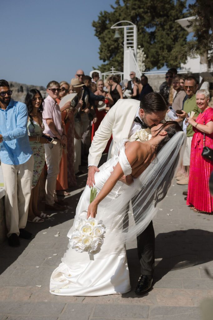 Romantic destination wedding on Rhodes, Greece, photographed in Lindos St Paul Bay
